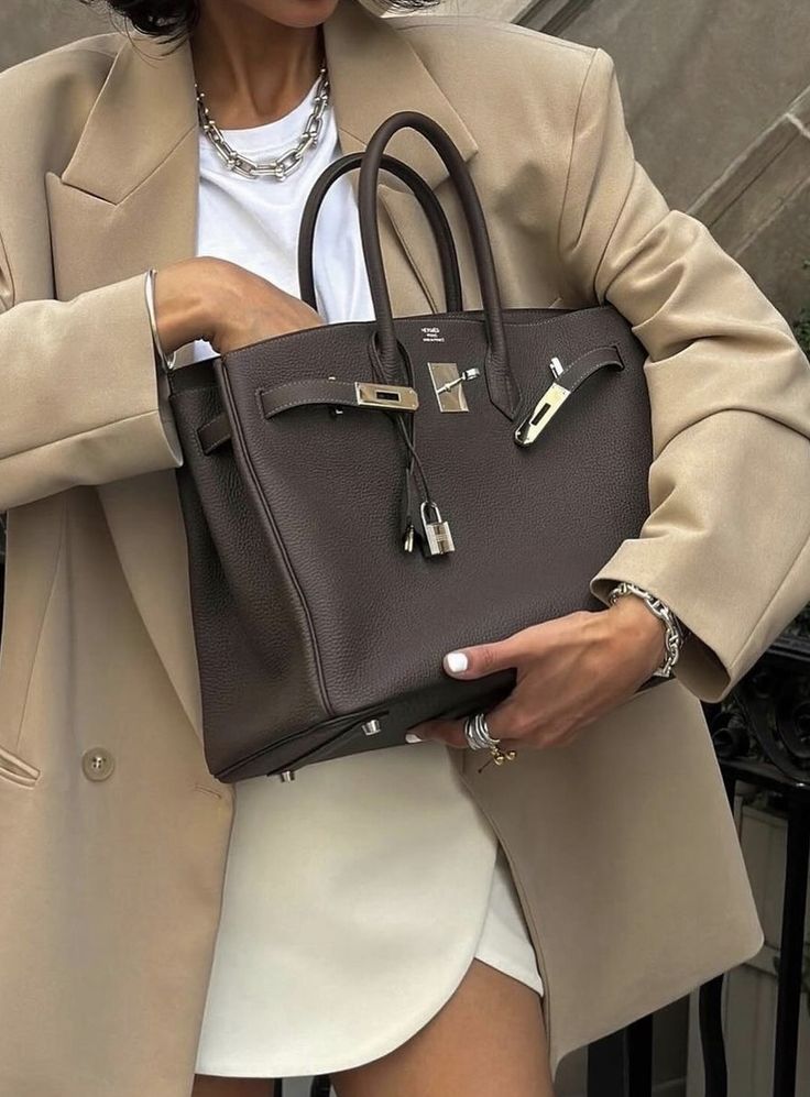 Crowd photographing a luxury crystal handbag, representing real-time brand perception on social